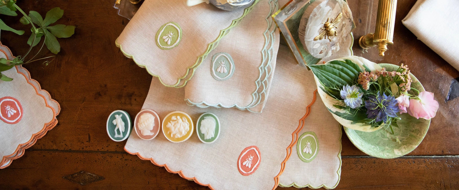 Decorative doilies with vintage-style designs on a wooden surface.