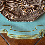 La Gallina Matta Parentesi Oval Placemats | Lagoon/Ocra - Set of 12